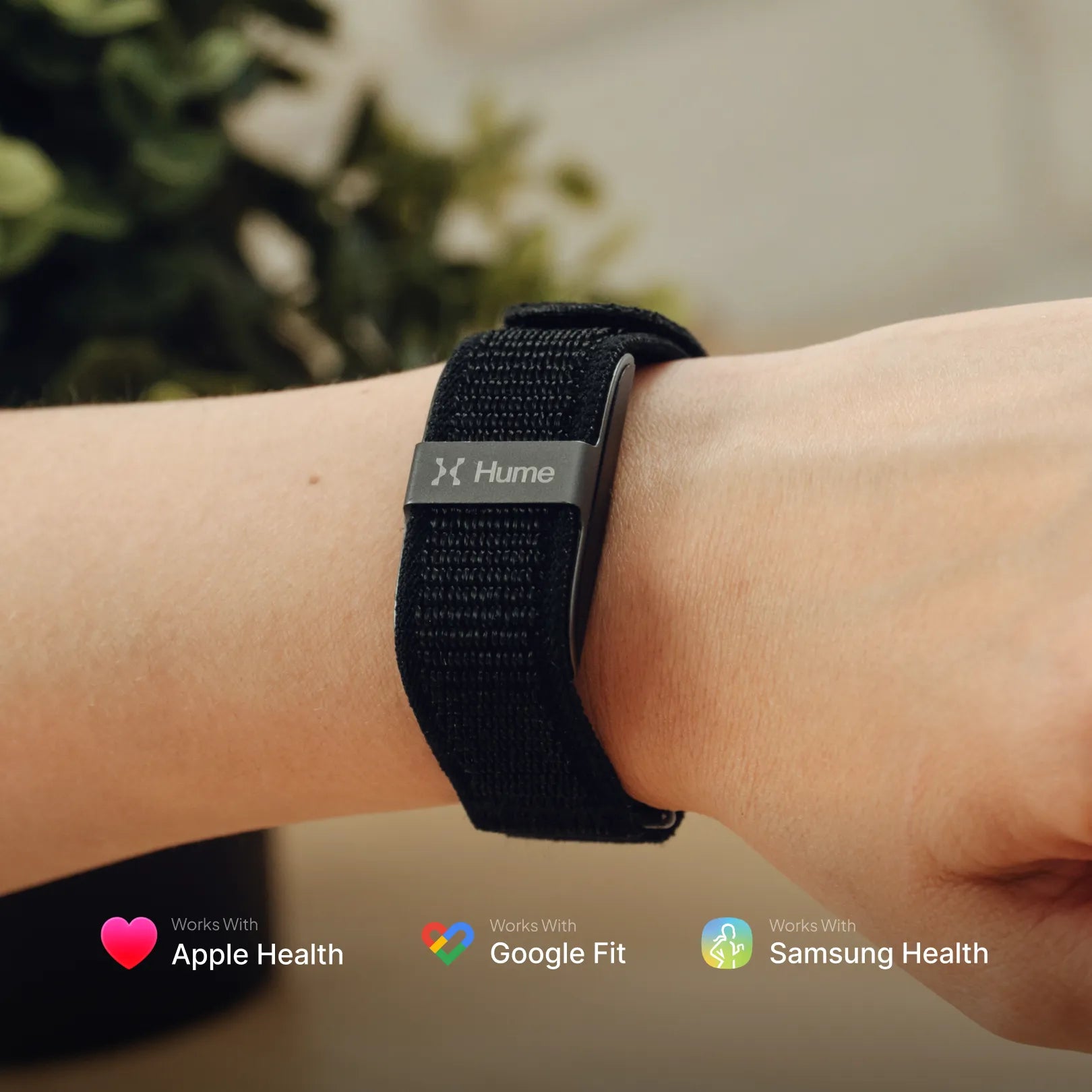 Black fitness tracker on a wrist with compatibility logos for Apple Health, Google Fit, and Samsung Health.