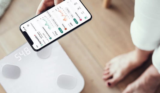 woman using Hume Health Body Pod and Hume app