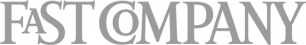 FAST COMPANY wordmark logo displayed in light gray uppercase letters on a transparent background.